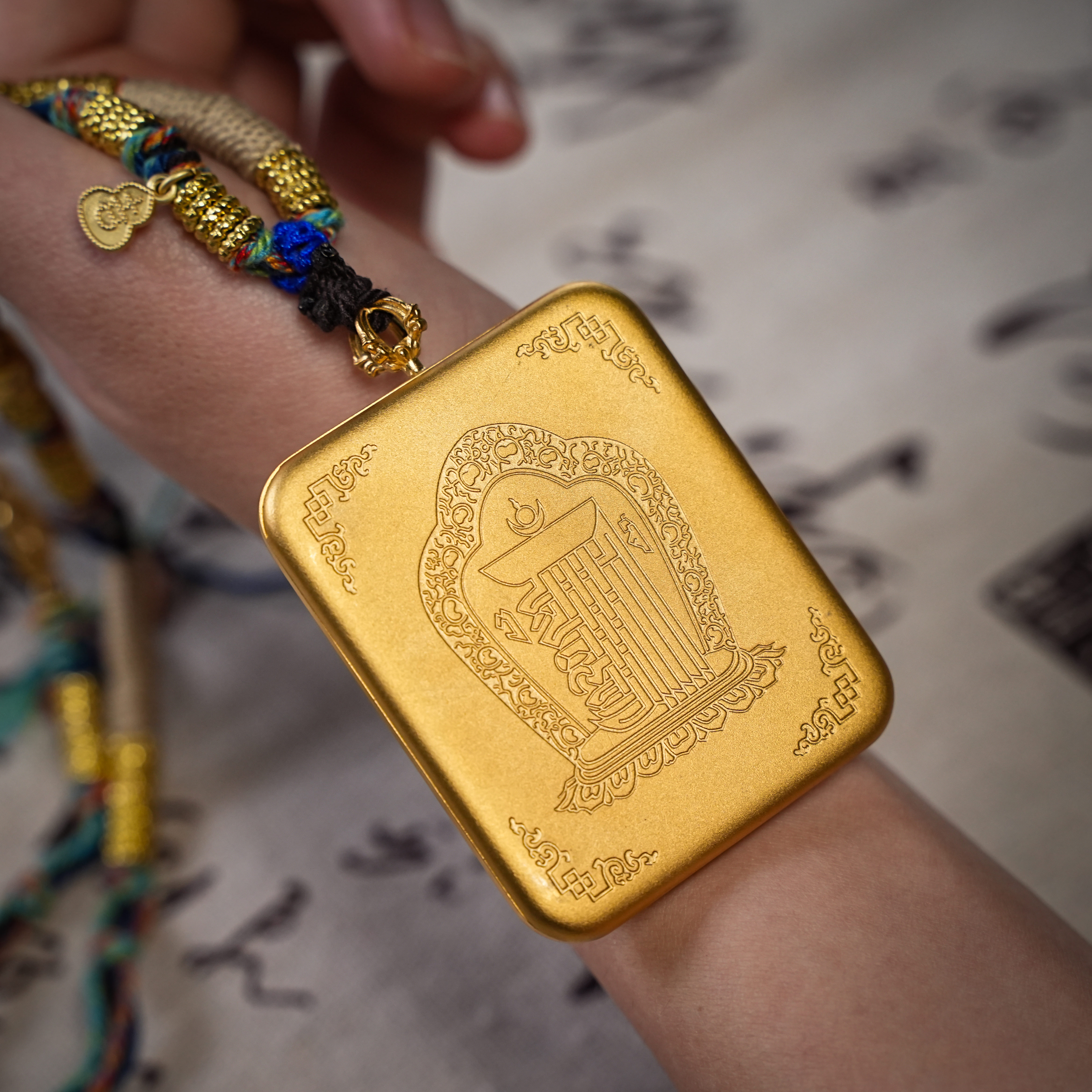 Hand-woven Tibetan cord with gold fittings and small bell