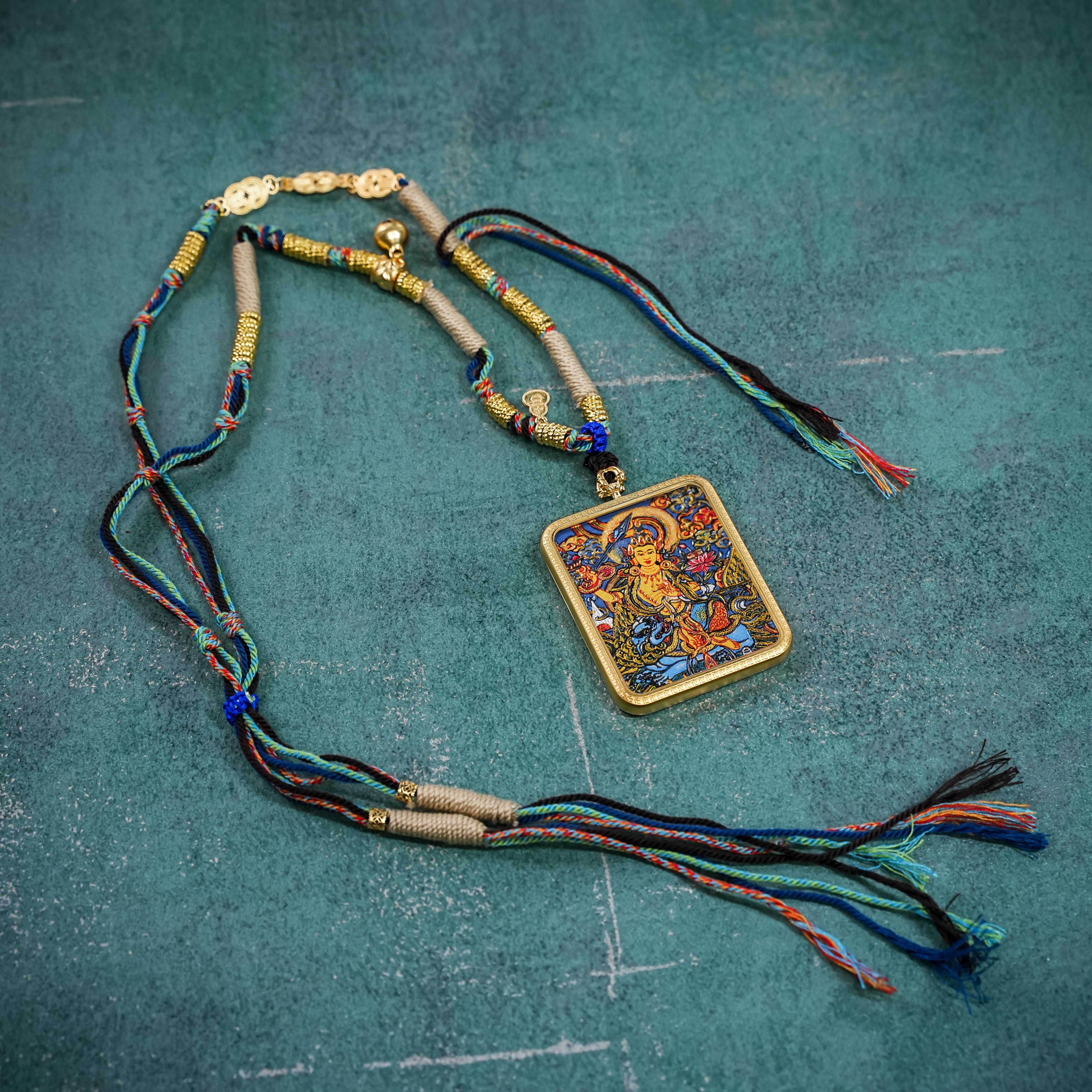 Mañjuśrī thangka gau pendant with sword motif